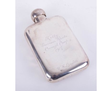 A silver hip flask with inscription dated 1917, height 14cm, approximately 4.80oz.