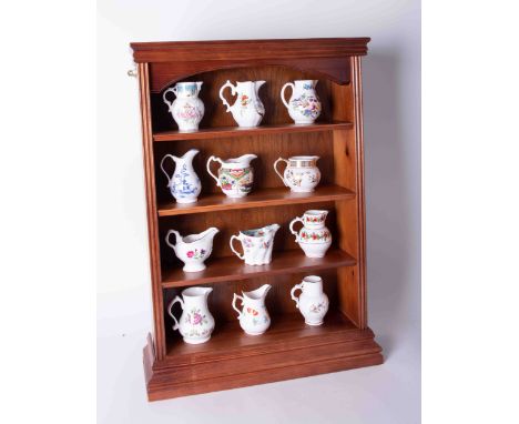 A collection of twelve Worcester Royal Historic porcelain jugs with certificates and display rack.