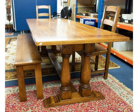 Brights of Nettlebed, a good quality oak 'trestle'  table of antique style together with a long bench and two Hunter style di