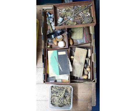 Five watchmakers drawers of various parts including tools, clock keys, brass gauges, watch brushes etc.