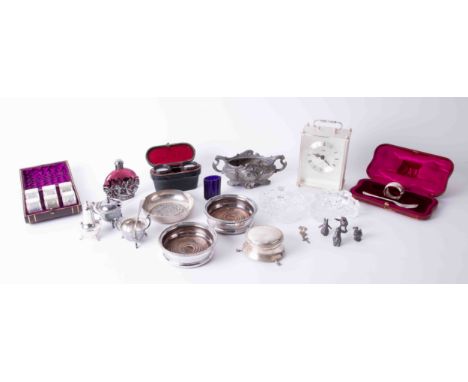 A silver circular box on three feet, a coloured glass and metal overmounted scent bottle, a silver napkin ring, a cased set o
