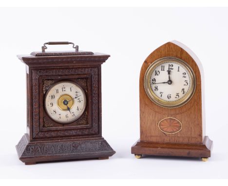 Edwardian mahogany and inlaid mantle clock, height 20cm together with a small carved oak bracket clock, the movement stamped 