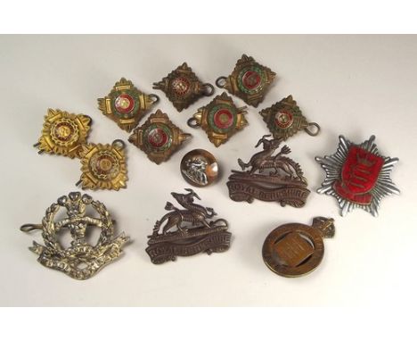 REGIMENTAL BADGES ETC.
Various regimental army badges & officers shoulder pips.