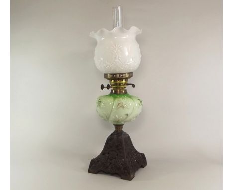 OIL LAMP.
A cast iron oil lamp, with glass fount. Max. height 58cm. CONDITION REPORTS: The fount is in generally good conditi