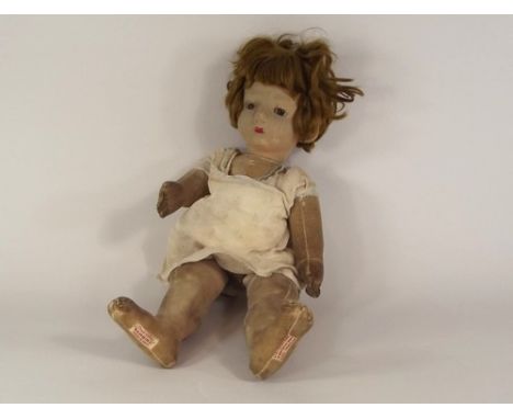CHAD VALLEY DOLL.
A Chad Valley, 'Bambina' fabric doll, worn & repaired.