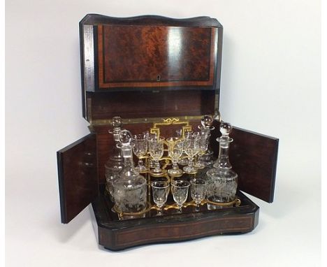 LIQUEUR DECANTER BOX.
An Edwardian burrwood, ebonised & strung liqueur decanter box, the serpentine front with a double-hinge