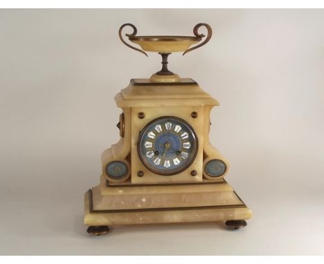 MANTEL CLOCK.
An alabaster architectural mantel clock, the metal dial with enamelled numerals. Height 33cm, width 28cm.