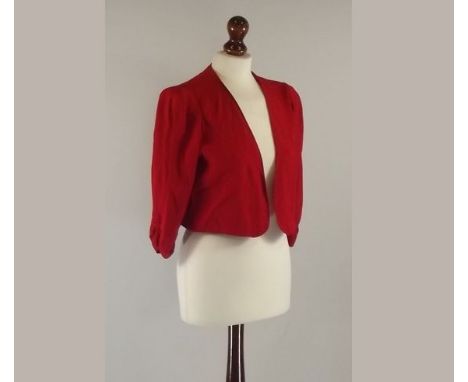 LADY'S JACKET.
A lady's red crepe, a short bolero jacket with ruched sleeves.