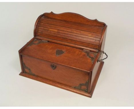 SMOKER'S CABINET.
An oak smoker's cabinet, the front with two tobacco compartments, the rear with a pipe rack behind a tambou