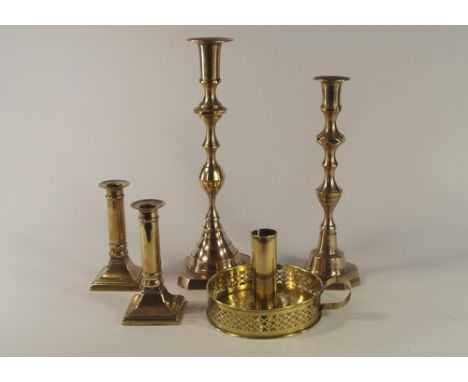 CANDLESTICKS.
A pair of plain column brass candlesticks, height 13.5cm, two single sticks & a brass ejector chamber stick.