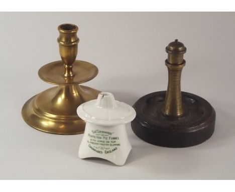 MISCELLANEOUS.
A Grimwade's pie funnel, a novelty 'lighthouse' cigarette lighter & a brass candlestick etc. 