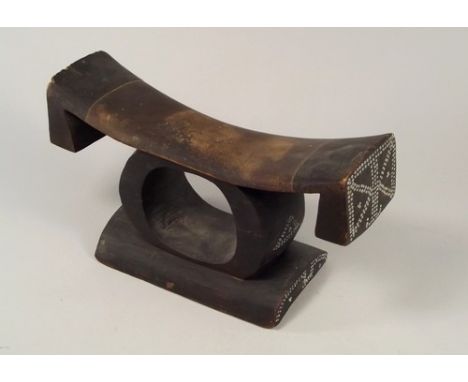 AFRICAN HEADREST.
A decorated African headrest, with inlaid beadwork decoration. Width 27 x height 13cm. CONDITION REPORTS: O