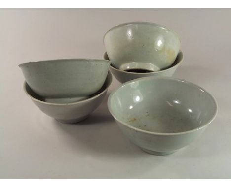 TEK SING CARGO.
Five Chinese Tek Sing cargo, porcelain bowls with slightly flared lip, each glazed very light turquoise, insi