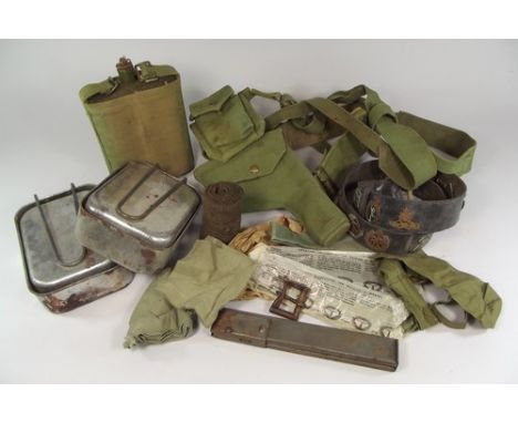 MISCELLANEOUS WWII ARMY ITEMS.
Various WWII army items including holster belt, water bottle, mess tins, collars, ties etc.
