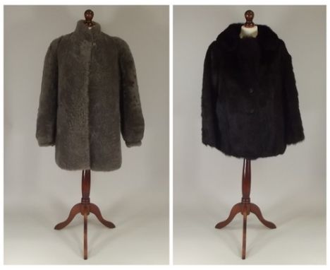 FUR JACKET ETC.
A short fur jacket, length 72cm & a grey sheepskin jacket, length 82cm. CONDITION REPORTS: The dark fur jacke