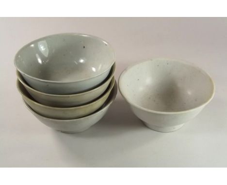 TEK SING CARGO.
Five Chinese Tek Sing cargo, porcelain bowls with slightly flared lip, each glazed very light turquoise, insi