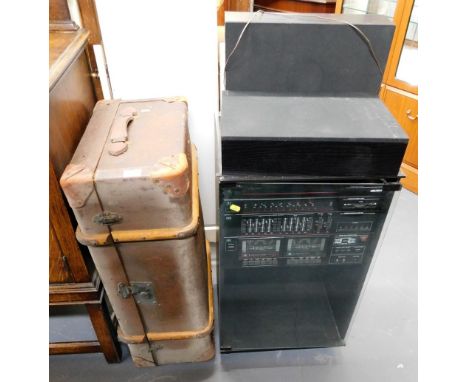 A canvas and wooden bound trunk, and a Bush music centre in cabinet.