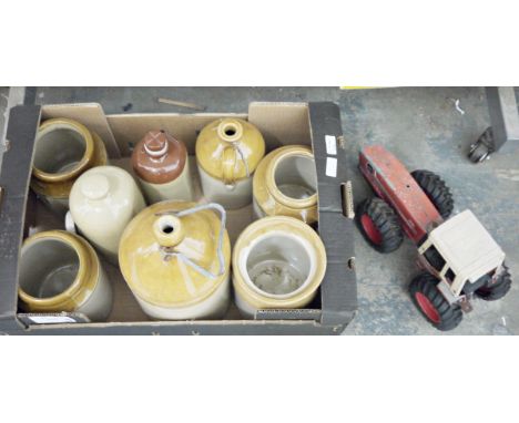Two stoneware flagons, two stoneware bottles and four stoneware jars together with toy Ertl international ant eater 3588 trac