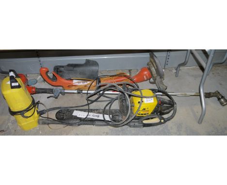 Collection of garden power tools including Karcher K 2.14 power washer, McCulloch Virginia MH542 chainsaw, Allen pro 26 brush
