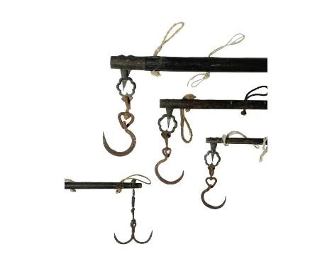 Four Chinese brass mounted wooden balance scales. Largest length 188cm, diameter 4cm. (4)