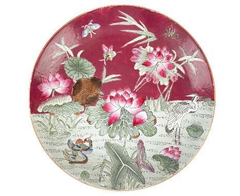 A large Chinese porcelain charger, Daoguang mark. Decorated with mandarin ducks, a crane and insects, with iron red seal, dia