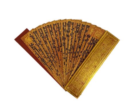 A Burmese Kammavaca manuscript, 19th century. With sixteen leaves and two red lacquer and gilded covers, 57 x 13.5cm, depth 3