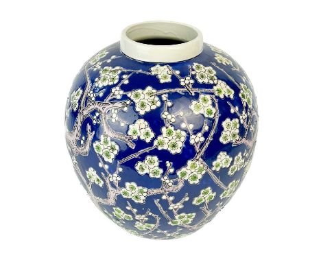 A Chinese porcelain prunus blossom ovoid vase, early-mid 20th century. The flowering trees with painted and enamel decoration