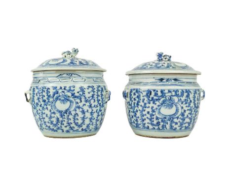 Two similar Chinese blue and white porcelain pots and covers.  Mid 20th century, decorated with flowerheads and vines, height