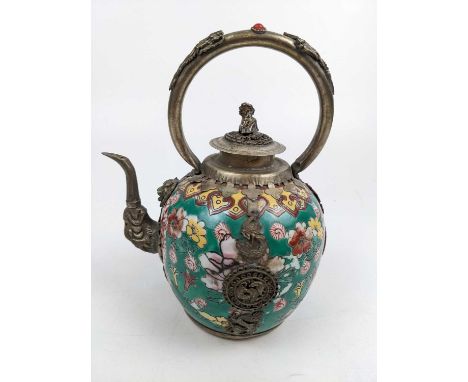 A Chinese porcelain and white metal teapot, early 20th century. Seal mark to base, height 19cm, width 15cm, depth 11cm.