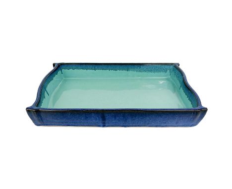 A Chinese blue-glazed pottery planter. Of rectangular form, with pale blue interior, incised seal mark, height 6cm, width 40.