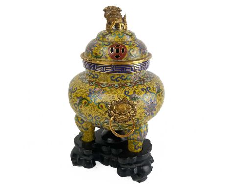 A Chinese cloisonne censer and stand, late 19th century.  The pierced cover surmounted by a gilt metal dog of fo, the yellow 