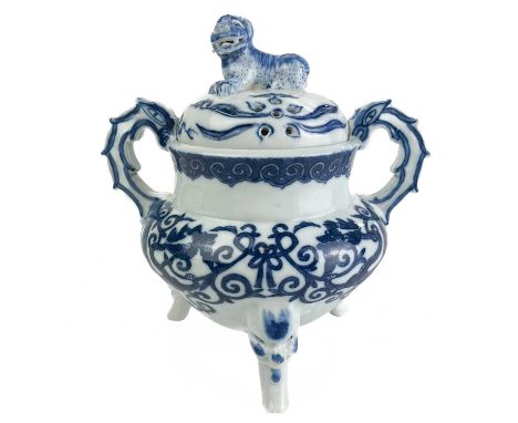 A Chinese blue and white porcelain censer, Qianlong seal mark.  The cover surmounted by a dog of fo, above a bulbous body pai