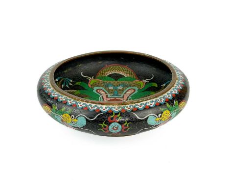 A Chinese cloisonne shallow bowl, 19th century. Decorated with dragons, four character seal mark to base, height 7.5cm, diame