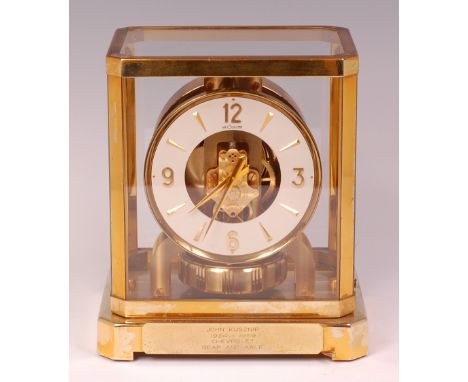 A Jaeger le Coultre gilt brass cased Atmos clock, having a circular dial with applied gilt chapters, signed 'Le Coultre Atmos