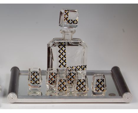An Art Deco Czech glass liqueur set, comprising; faceted decanter and stopper having engraved line detail, further heightened