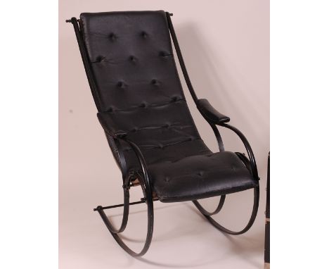 After R. W. Winfield - A black painted metal framed open rocking armchair, having black leather one-piece cushion, w.60cm