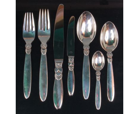 A Georg Jensen sterling silver single place setting cutlery suite, comprising; dinner fork, dessert fork, dinner knife, butte