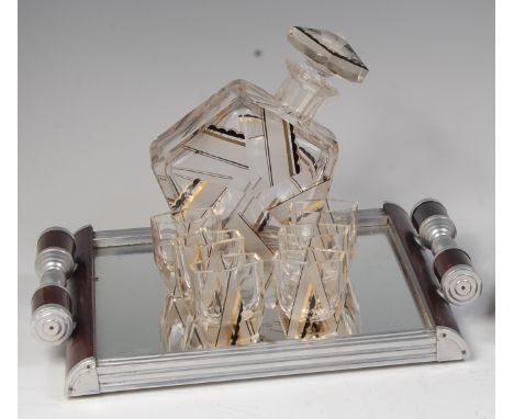 An Art Deco Czech glass liqueur set, comprising; decanter and stopper of faceted pentagon form with gilt banded detail and si