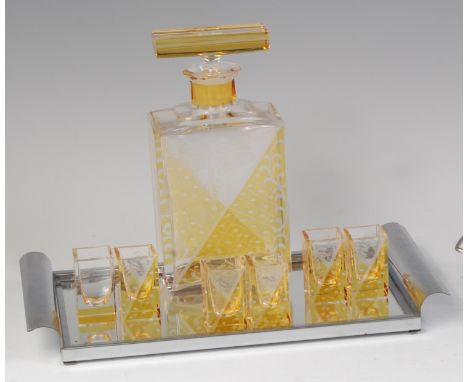 An Art Deco Czech glass liqueur set, comprising; decanter and stopper of rectangular form, with faceted edge, either side wit