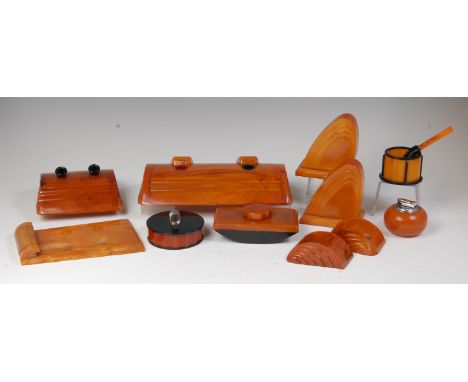 A collection of Art Deco bakelite desk accessories, to include; twin inkwell with stepped covers, w.29cm; twin fountain pen h