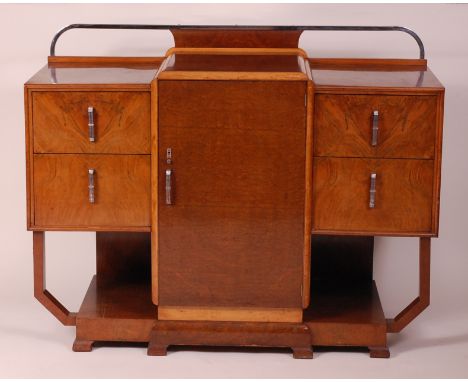 An Art Deco figured walnut and chrome mounted sideboard, having a tubular chrome raised ledgeback over slightly raised single