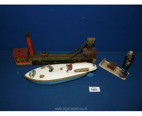 A Sutcliffe Models ''Blue Bird'' clockwork Speedboat, 10 3/4'' long (working order) and with key, a German made tin-plate coa