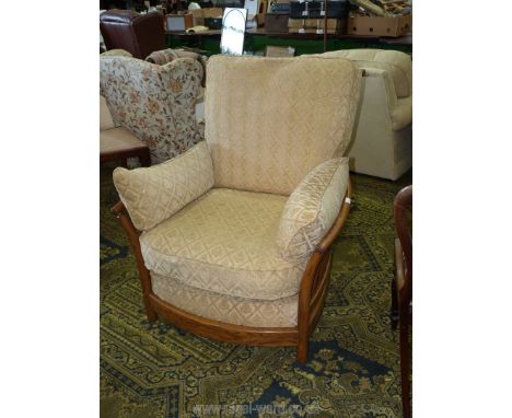 A stylish Ercol Elm wood framed 'Renaissance' easy Armchair, having beige shadow cushions, model no. 1068.