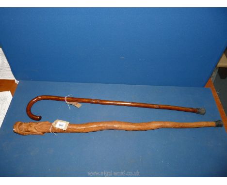 A carved head, hardwood "Shillelagh" type walking stick club,  approx. 35" long, and a traditional cabbage stalk stick.