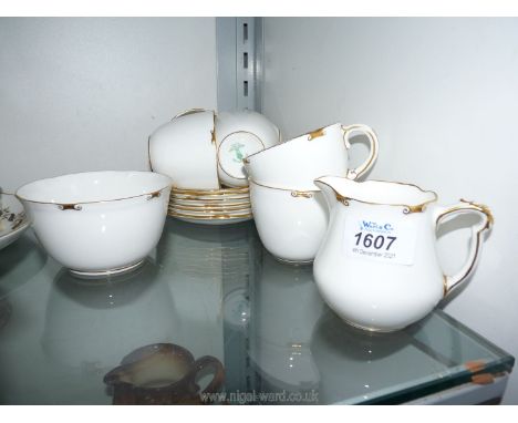 A Royal Crown Derby gilt rimmed 'Regency' part Teaset, including six cups, six saucers, milk jug and sugar bowl.