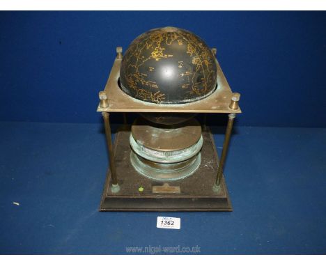 A Royal Geographical Society World Clock, date 1979 to base, a terrestrial globe supported by a gilt metal frame, the black g