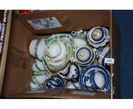 A quantity of B &amp; S 'Warwick' vintage bone china, c. 1916-1930 in green and gold, to include seven cups, ten saucers, six