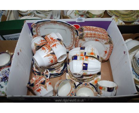 A Victorian bone china teaset including five cups and saucers and five tea plates, Wellington china including six cups and sa