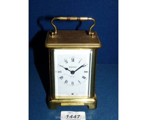 A bevelled windowed Brass Carriage Clock by ''Bayard'' having a  French 8 day movement.  The rear brass plate of the movement
