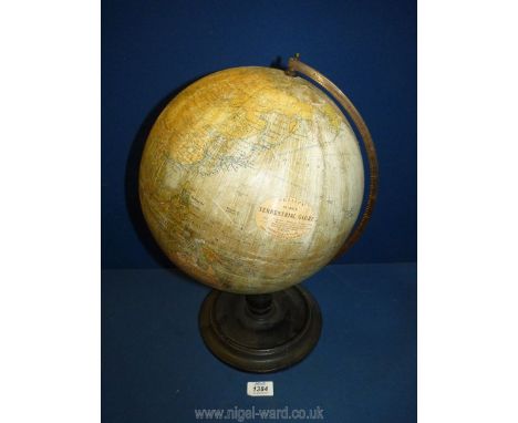 A Phillips 12" Terrestrial globe, some small tears to globe, 17" tall.